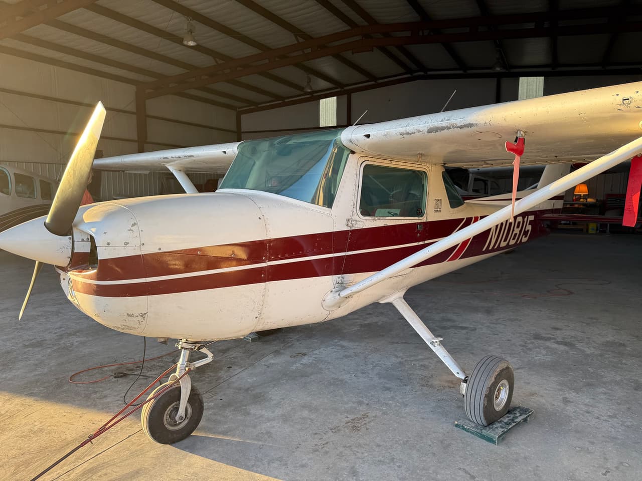 Oklahoma Flight Academy’s Cessna 150 trainer, tail number N10815, in the hangar